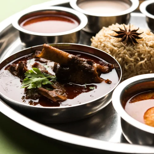 motton-thali-gosht-lamb-platter-is-indian-asian-non-veg-lunch-dinner-menu-consists-meat-egg-curry-with-chapati-rice-salad-sweet-gulab-jamun (1) (1)